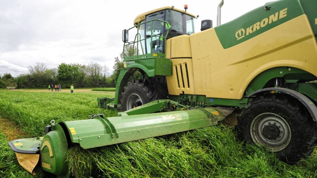 Despite Krone selling everything it can produce, and more besides, the business of bringing dealers and their staff up to scratch with the latest equipment is still a vital part of the machinery business. Recently, Farmhand held a series of training days for its distributors of the company’s machinery at Lyons Farm, Co. Kildare, and took the opportunity to demonstrate it while still gathered in one field. Another busy year for Krone Business is booming for the company, with the number of units being sold far out exceeding the number the factory was intending to produce. So much so in fact, that the company has recently purchased another 25ha of space, and intends on expanding further over the next few years. Krone machinery Scivener When lined up, the Krone range makes an impressive display Krone is still a family owned company that prefers to grow organically rather than through acquisition, and it has achieved this aim, it believes, by maintaining family values. Within Ireland this is exemplified by the close working relationship it maintains with the Scrivener family, who own and run Farmhand very much in a ‘hands-on’ manner. Beer-bottle length Paul and Stephen Scrivener had been present throughout the training days, ensuring that the dealers, the majority of whom are family run as well, and their technicians were up to speed with the latest equipment. The benefit of getting machines set-up properly was a major theme of this year’s event and leaving a little more stubble than is the custom when cutting in Ireland featured strongly in the presentations. Clover swards UCD A good stand of clover was present within the sward The trend in Germany, apparently, is to leave a stubble about the length of a beer-bottle neck in the field, rather than try to bring the crop, complete with topsoil, home. Leaving a little more behind not only eases the strain on the machines, but encourages regrowth as well as reducing contamination by soil and faeces. Familiar fields The fields in which the machines were operating were the very same as those visited by Agriland back in February, when we took a look at the latest Grasstec metered slurry system. Krone Grass clover Big X With over 1150hp on tap, the Big X was little more than nibbling at the swath The crop had grown well with a very noticeable clover content that was present throughout the height of a rather open sward. There was no sign of any of the slurry applied a few months earlier and growth was consistent throughout the field. Mighty engine Krone had brought along a variety of grassland machines to demonstrate to the dealers, the big ticket item being its flagship forage harvester, the Big X 1180. Engine forage harvester krone This is what 24L of Liebherr engine looks like at the rear end of a Big X With 24L of V12 engine Liebherr purring away in the back, it hardly noticed what was put in front of it at the reduced operating speed necessitated by the presence of people in the field. 1156hp may sound something of an extravagance but Krone has sold several of these units into Ireland, which remain very much contractor machines. Mowing made easy The big, heavy grass crops which they are designed to cope with also require robust machines to cut, ted and rake it, and there are no mowers larger than the big M, with its 10m cut. Despite the self-propelled machine drawing all the attention, Krone also had a new trailed mower to show on the day. Krone trailed mower The latest trailed mower has several new design features including wheels mounted inside the frame width Although it is based on its predecessor, there have been several improvements, including the relocation of the trailer wheels to inside the frame, making it easier to pass through narrow gateways. Tedders and rakes Also revamped for this season is the latest Vendro tedder, which appears to have been beefed up and is now equipped with new ‘C’ type tines, which are said to be more efficient at picking up grass. Krone field grass The latest Vendro tedders remain popular machines with farmers When it comes to raking, the Swardo TC 1370 was on show, a rake which has an adjustable width reaching from 13.7m down to 10.8m. This particular model was also fitted with section control, lifting the rotors in and out of work as required, to leave a neat finish. Grass sward clover rake The Swardo TC 1370 can reach out to 13.7m and comes fully equipped with section control Harvesting the grass is not the sole preserve of the Big X. Krone still does a steady business in forage wagons despite other manufacturers dropping them from their product lines. Forage wagon grass krone The forage wagon is still a steady seller for krone, which brings in around 15 a year The demand stems mainly from dairy farmers who wish to retain the independence and flexibility of doing it themselves. The machines also give a longer chop which many prefer, believing that it is kinder on a cow’s rumen.